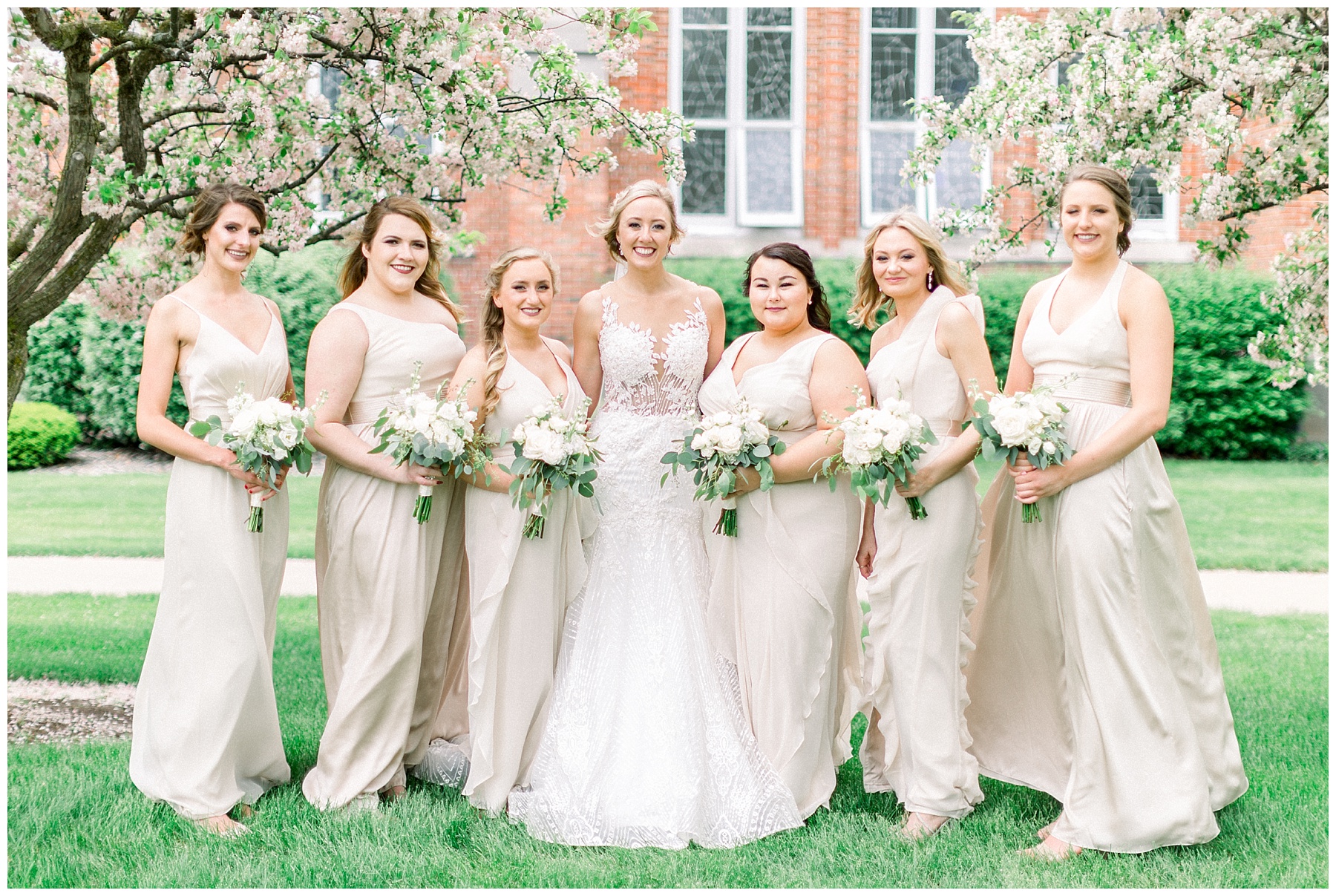 bride and bridesmaids in long champagne dresses